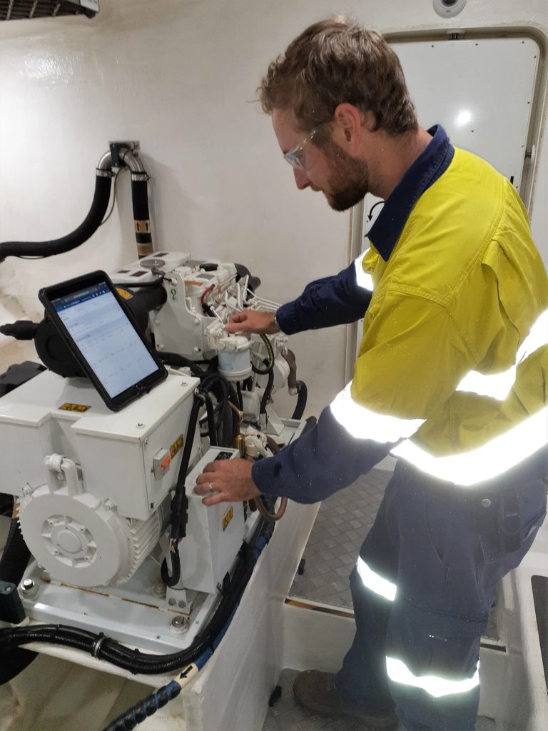 Odyssey Marine crew using Helm CONNECT on a tablet